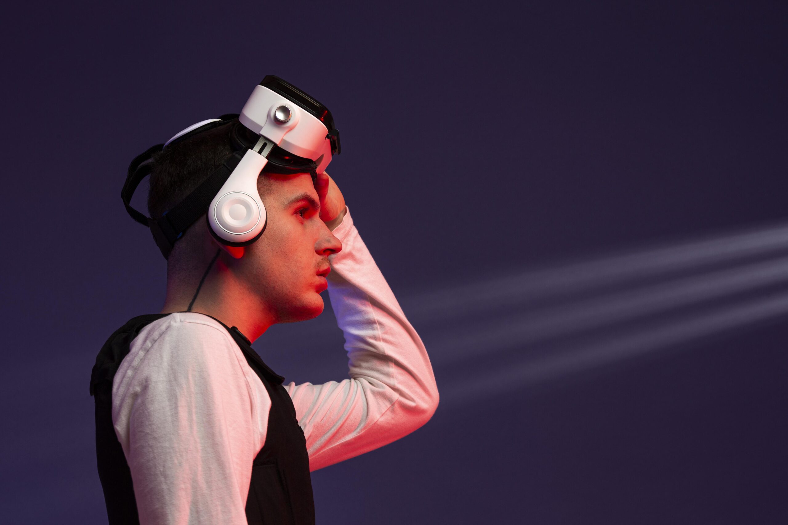 Young man wearing virtual reality goggles for games